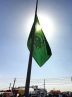 اهتزاز پرچم ۱۴۴ متری حرم امام رضا (ع) در میدان نماز اسلامشهر